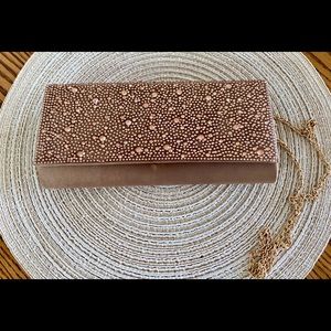 Dusty rose clutch purse with chain shoulder strap. Elegant and convenient!